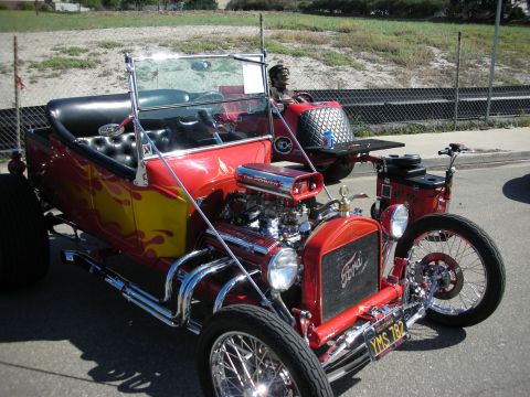 1998 Ford Crown Victoria - Custom hot rod with V8 engine and flame paint job parked outdoors.