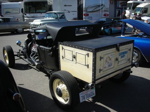 1998 Ford Crown Victoria - A custom hot rod with a refrigerated box 'Escondido Dairy' branding is parked at an outdoor event.