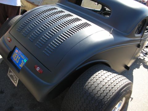 1998 Ford Crown Victoria - Rear view of a custom hot rod coupe with a matte black finish and distinctive slotted decklid.