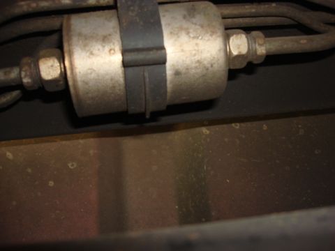 1983 Ford Bronco - the stockfuel filter is in the frame rail below the drivers seat. i used a jack to lift the suburban up alittle and make more room.