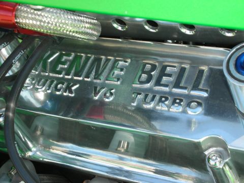1998 Ford Crown Victoria - Close-up of a chrome engine cover with "Kenne Bell Buick V6 Turbo" embossed on it.