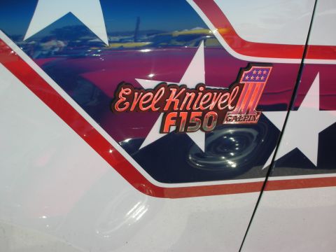 1998 Ford Crown Victoria - Close-up of an Evel Knievel F150 decal with patriotic stars and stripes.