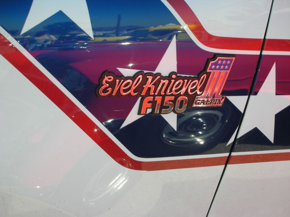 Evel Knievel F150 Galpin emblem with stars and stripes on a white truck body panel