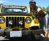 1968 Ford Mustang - A woman poses with a yellow Jeep Wrangler, which features KC lights on the front bumper.