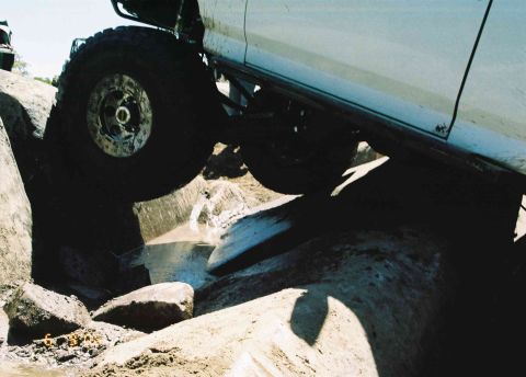 1995 Ford Bronco - This 1995 Ford Bronco is shown side-on as it maneuvers through a challenging rocky obstacle course.