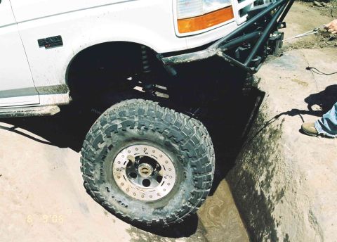 1995 Ford Bronco - Front wheel and fender of a 1995 Ford Bronco during an off-road excursion.