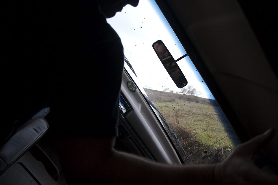 Interior view from passenger seat looking towards dashboard and windshield