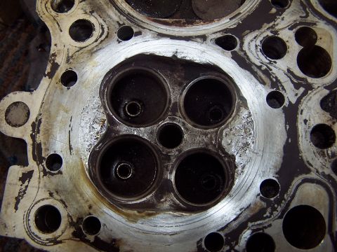 1994 Ford Probe - This image shows a used engine cylinder head, likely needing repair or replacement.