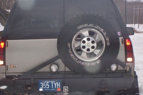 2000 Chevrolet Tahoe - The rear of a 2000 Chevrolet Tahoe shows a spare tire, a Michigan license plate, and a "Z71" badge.