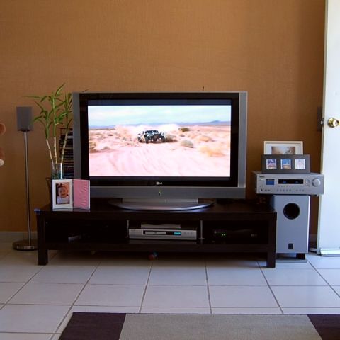 1992 Ford Explorer - A vehicle is seen driving on a dirt road in a desert landscape.
