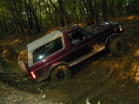 1996 Ford Bronco - This 1996 Ford Bronco is stuck in the mud while off-roading in a wooded area.