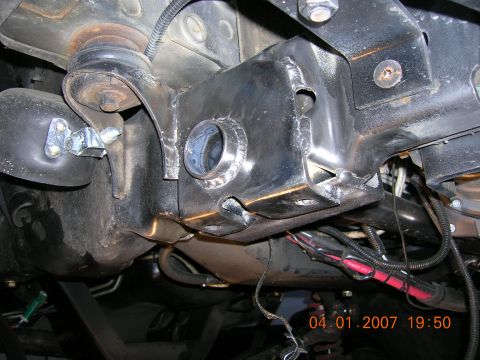 1996 Ford Bronco - Undercarriage view of modified vehicle frame with visible welds and electrical wiring.