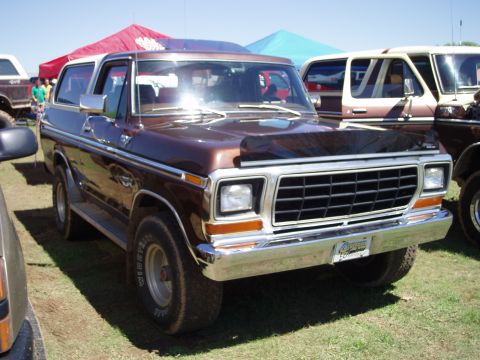 1978 Ford Bronco - This 1978 Ford Bronco features a two-tone brown and white paint scheme and a prominent front grille.
