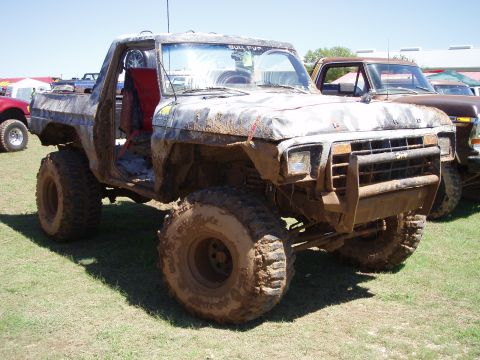 1978 Ford Bronco - This heavily modified truck is covered in mud, suggesting it has seen off-road action.