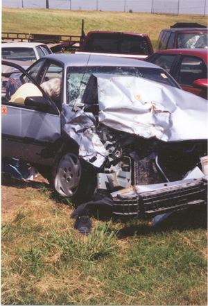 1996 Ford Bronco - This sedan sustained severe front-end damage, likely from a collision.