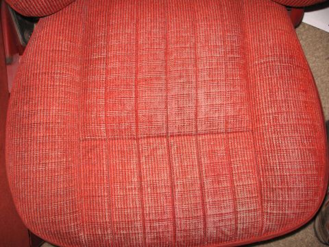 1990 Ford Bronco - The fabric on this vehicle seat has a distinct red and white checkered pattern.