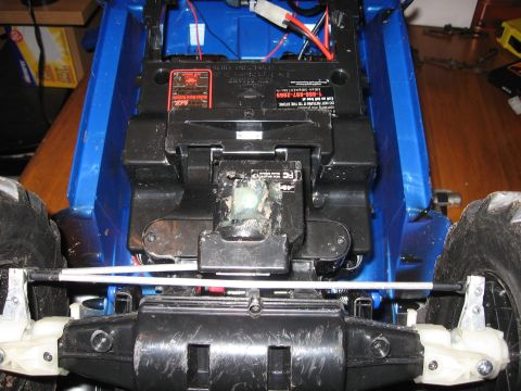 1990 Ford Bronco - Close-up view of the interior components and wiring of a blue remote control car.