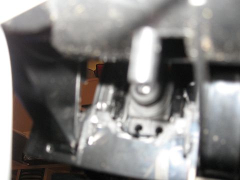 1990 Ford Bronco - A detailed view of a vehicle's internal mechanical component, showing metal and plastic parts.