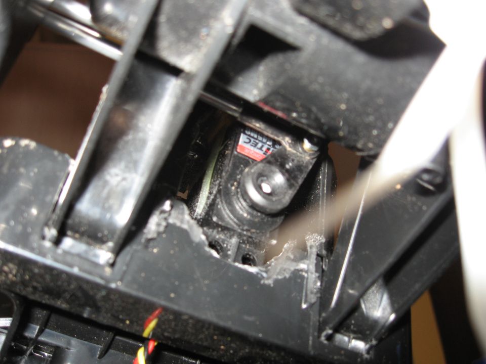 Close-up of a black servo motor with red and white 'ITEC' label