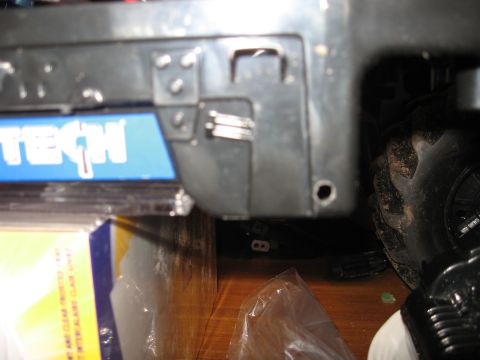 1990 Ford Bronco - A partial view of a vehicle's exterior component, with a tire in the background.