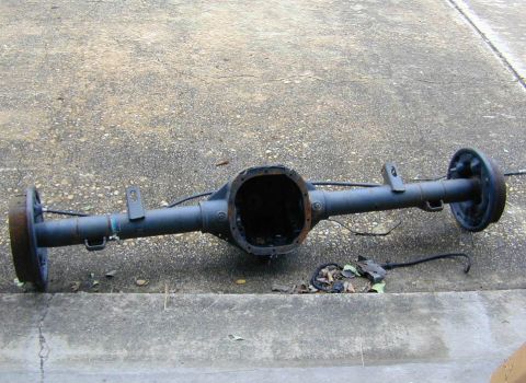 1996 Ford Bronco - This is a rear axle assembly, likely from a truck or SUV, shown without its differential cover.