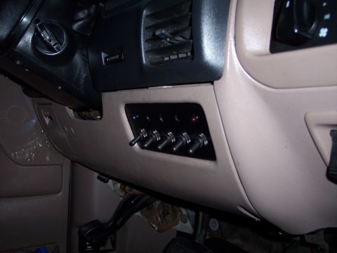 1996 Ford Bronco - Black plastic toggle switches and two LEDs in...just waiting for the rest of the LED's to arrive from Del City in order to hook it all up.…