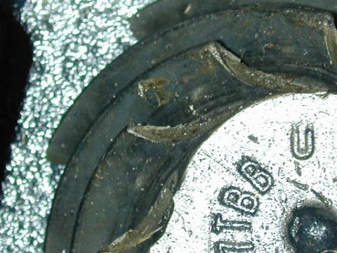 1996 Ford Bronco - Detail of a metal component showing stamped text '1B8' and a website address.