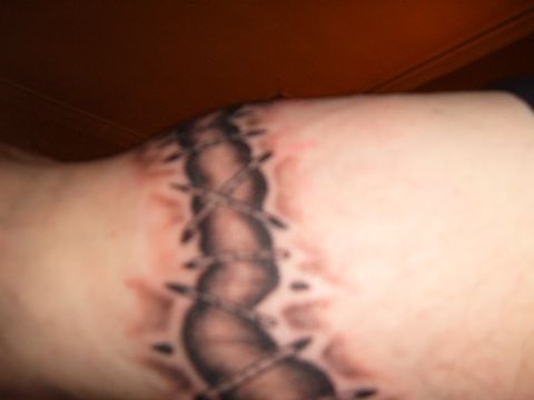 1993 Ford Bronco - This is a tattoo of a stitched wound on skin.