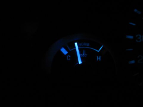 1995 Ford Thunderbird - Close-up of a blue illuminated temperature gauge with the needle indicating a cold engine.