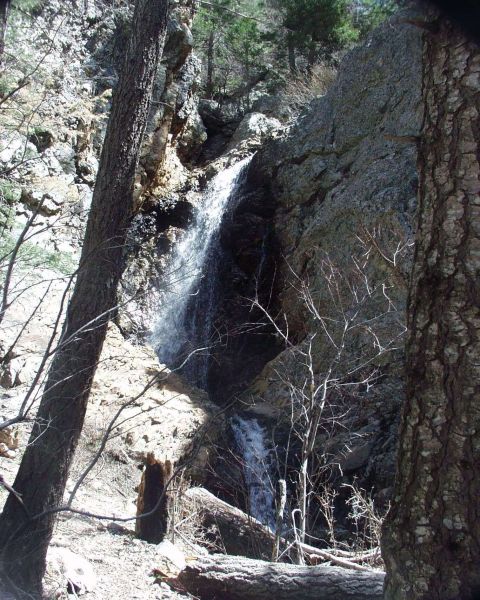 1997 Ford F-250 - A scenic view of a waterfall surrounded by trees and rocks, with a Supermotors.net watermark at the bottom.