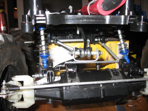 1990 Ford Bronco - Close-up view of a remote control car's suspension and drivetrain components.