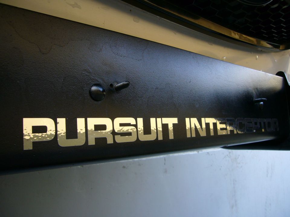 Black push bumper with gold "PURSUIT INTERCEPTOR" text