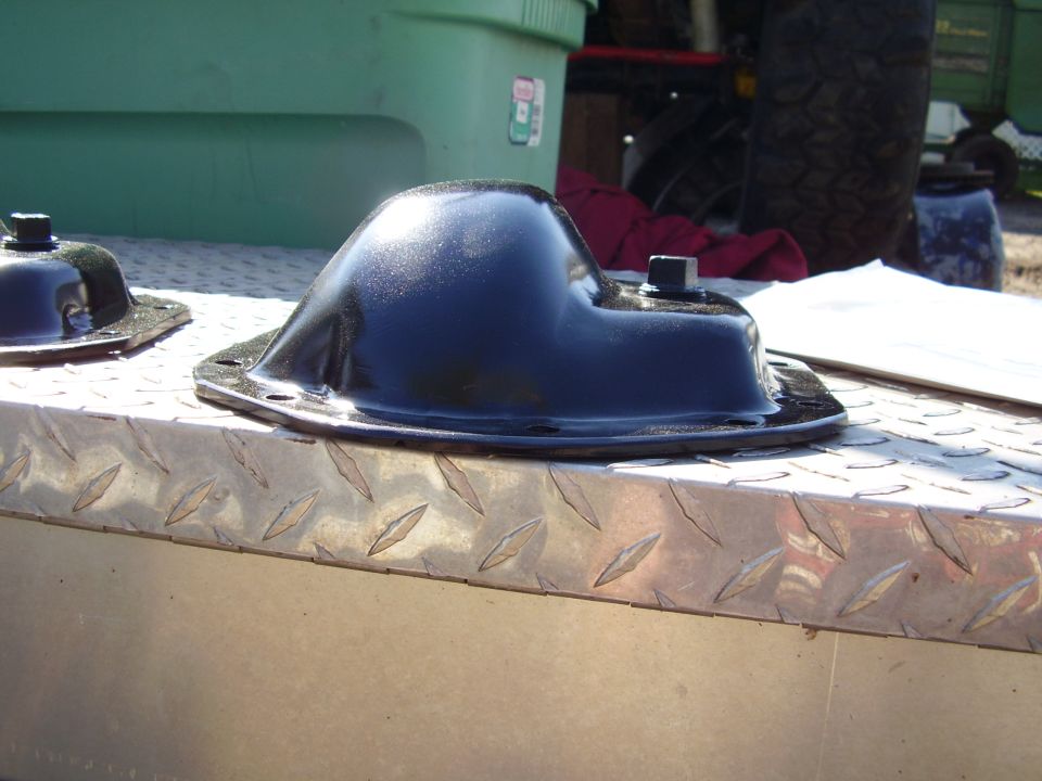 black metal automotive part on diamond plate surface
