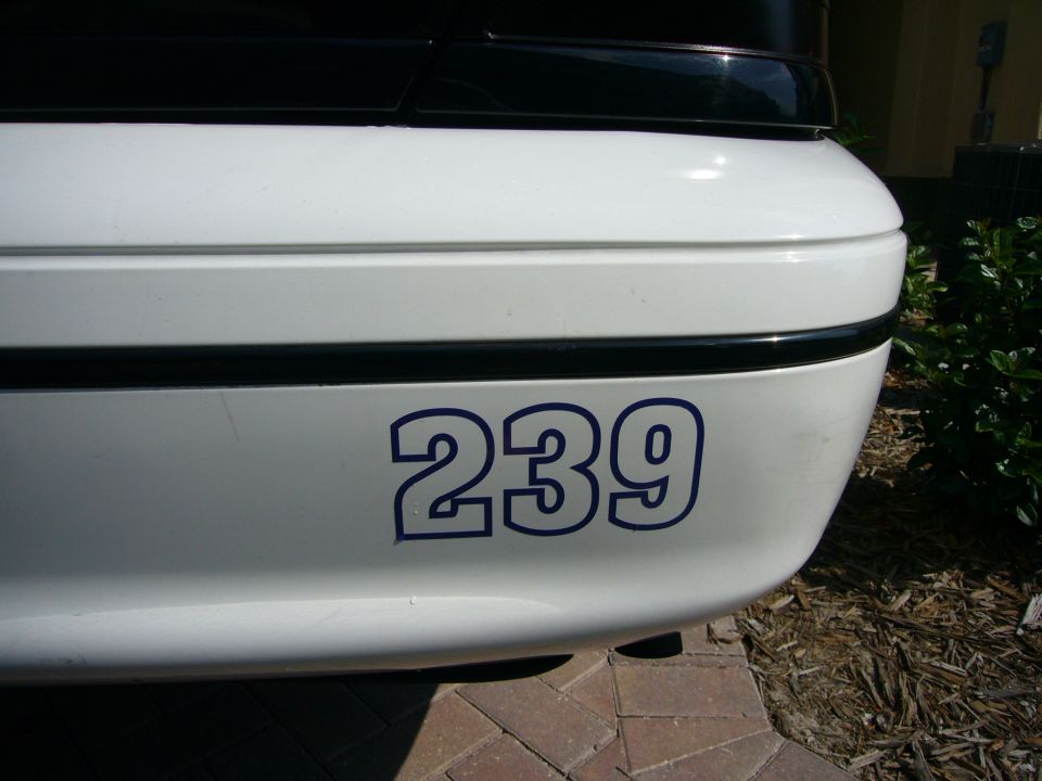 White rear bumper with blue number 239