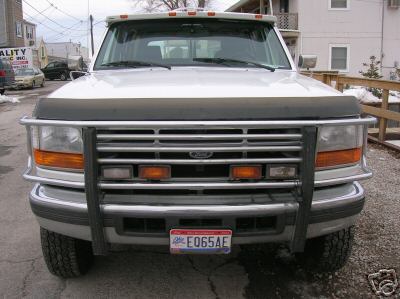 1995 Ford C-350 (Centurion Conversions) - This 1995 Ford C-350 (Centurion Conversions) is shown from the front, a prominent chrome grille guard.