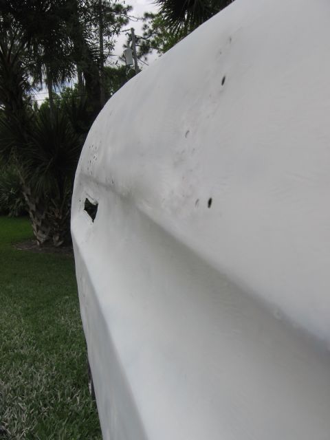 1974 Ford F-100 - Side view of a white 1974 Ford F-100 truck door, showing its distinctive body lines.
