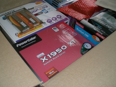 1995 Ford Probe - Computer hardware components are visible inside a cardboard box, including graphics cards and a motherboard.