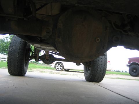 2001 Jeep Wrangler - The underside of a vehicle is captured, with another vehicle partially visible in the distance.