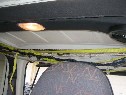 2001 Jeep Wrangler - Straps are secured above the interior of the vehicle.
