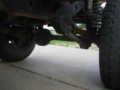 2001 Jeep Wrangler - The undercarriage of a 2001 Jeep Wrangler, highlighting its suspension components and differential.