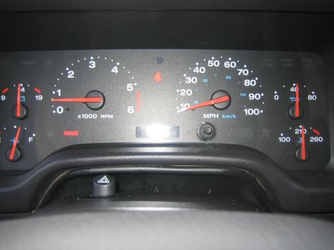 2001 Jeep Wrangler - The instrument cluster shows the vehicle's speed, engine RPM, fuel level, and engine temperature.