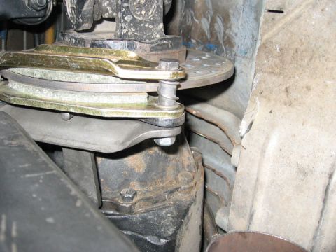 1994 Ford Bronco - Close-up view of a vehicle's parking brake mechanism.