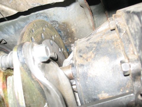 1994 Ford Bronco - Close-up view of a vehicle's brake rotor and caliper assembly.