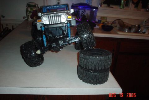 2000 Ford Crown Victoria - Remote control Jeep Rubicon toy with extra tires on a kitchen counter. The photo is dated August 19, 2006.