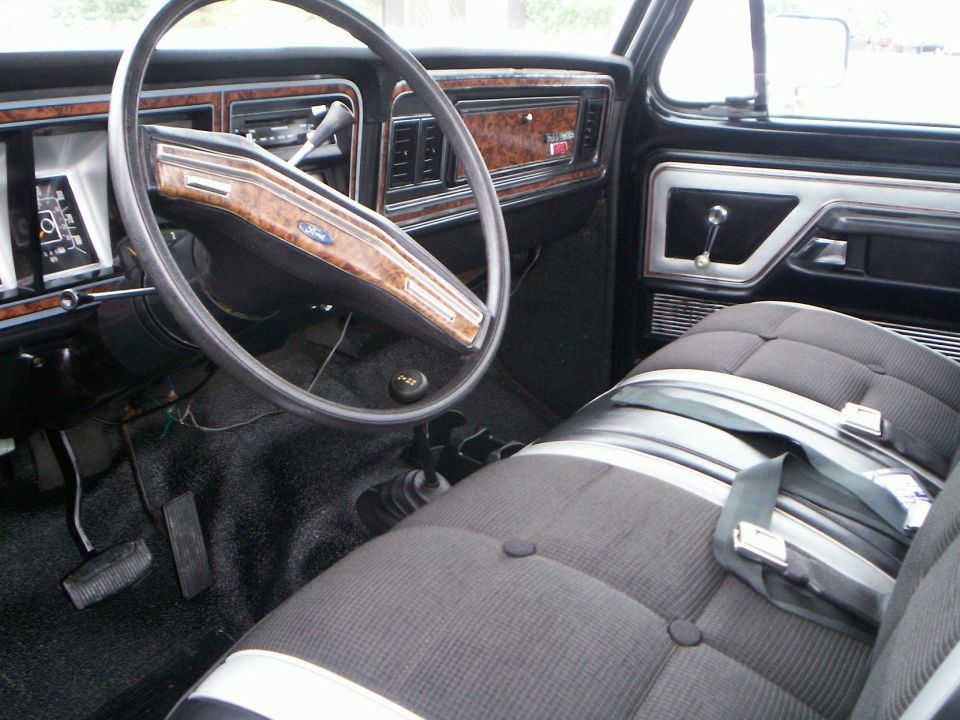 Interior of a 1979 Ford F-250, showing the dashboard, steering wheel, and seats