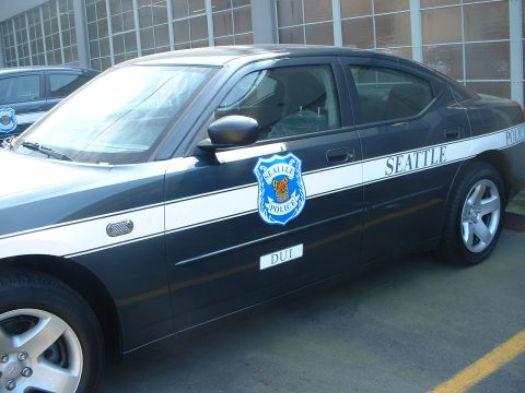 2000 Ford Crown Victoria - A Seattle Police car is parked, showing its side profile with police markings and a DUI designation.