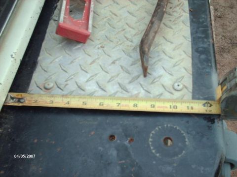 1990 Ford F-150 - Tools and a tape measure are placed on a diamond plate surface, with a date stamp visible.