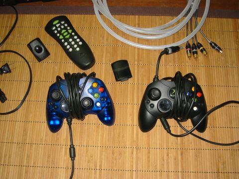 1996 Ford Bronco - Video game controllers and accessories are laid out on a bamboo mat.