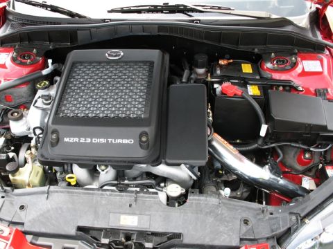 2006 Mazda 6 - The engine bay of a Mazda 6 features the MZR 2.3 DISI Turbo engine with its distinctive black cover.