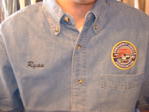 2000 Ford Crown Victoria - This photo shows a denim shirt with an embroidered name and a patch for the Emergency Vehicle Owners & Operators Association.